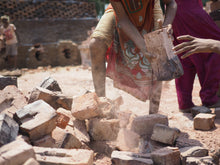 Load image into Gallery viewer, An Indian child in slavery works in a mine, waiting to be rescued