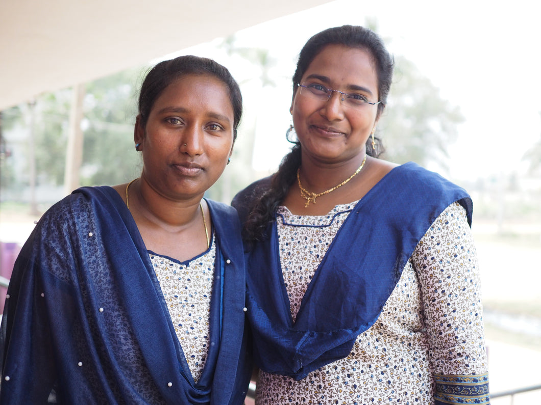 Two Indian women wearing blue ready to devote their lives to teach and educate children rescued from sex and labor trafficking