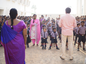 A group of Indian children in uniform with their teachers. The teachers are ready to devote their lives to teach and educate victims of trafficking