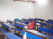 Load image into Gallery viewer, Buy desks, backpacks, and new textbooks when you purchase this classroom for rescued children. 