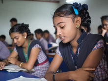 Load image into Gallery viewer, Indian girls in a classroom getting educated to better their lives after being trafficked