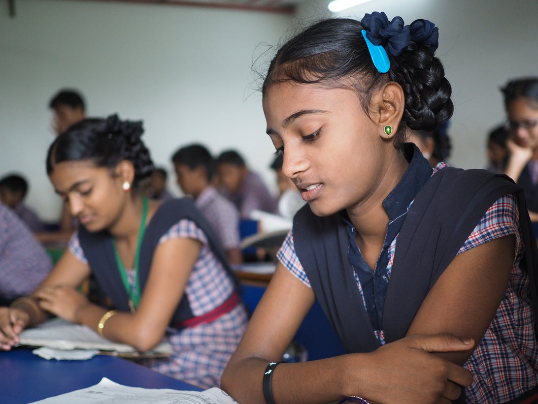 Indian girls in a classroom getting educated to better their lives after being trafficked