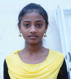 Little Indian girl rescued from slavery or human trafficking with a yellow shirt