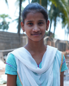 Little Indian girl with a light blue shirt rescued from slavery or human trafficking