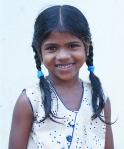 Little Indian girl with a light blue shirt rescued from slavery or human trafficking