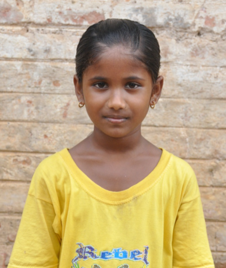 Little Indian girl with a yellow shirt rescued from slavery or human trafficking
