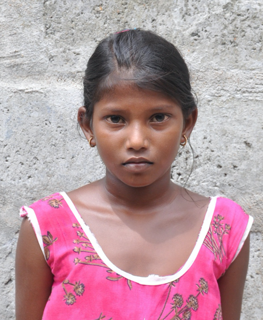 Little Indian girl with a pink shirt rescued from slavery or human trafficking