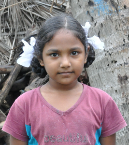 Little Indian girl with a pink shirt rescued from slavery or human trafficking