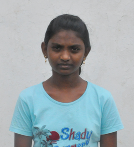 Little Indian girl with a light blue shirt rescued from slavery or human trafficking