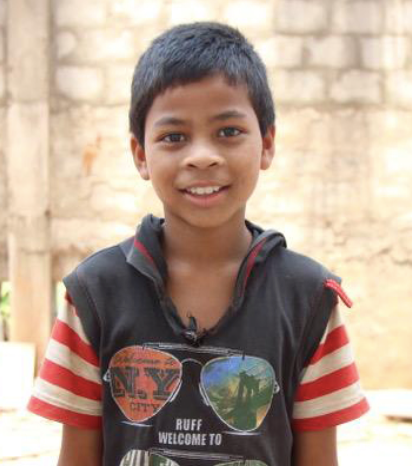 Little Indian boy with a black hoodie rescued from slavery or human trafficking