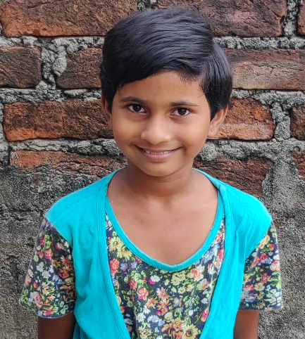 Little Indian girl with a blue shirt rescued from slavery or human trafficking